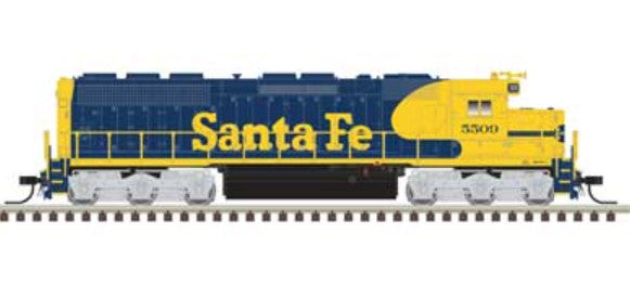 Model train engine in Santa Fe blue and yellow livery on a white background