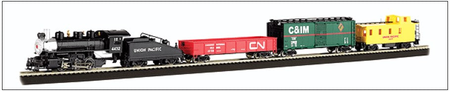 Model train set with various colored cars on a track