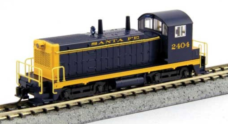 Model train locomotive with 'Santa Fe' branding on a track