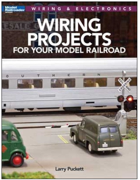 Book cover of 'Wiring Projects for Your Model Railroad' with a model train and van on a road.