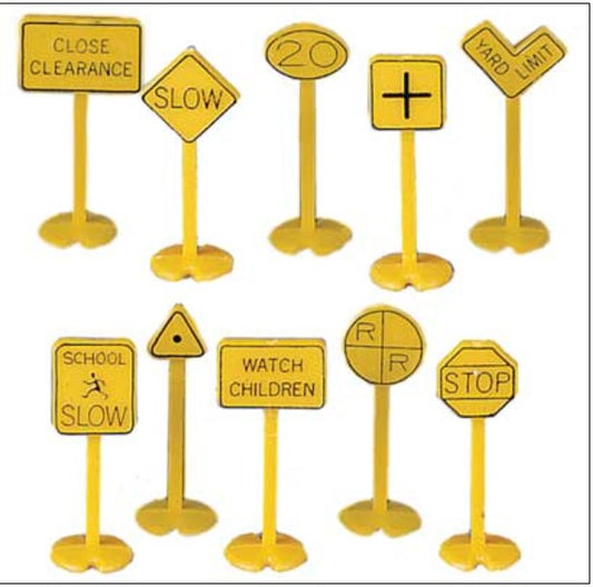 Set of miniature yellow road signs on stands against a white background