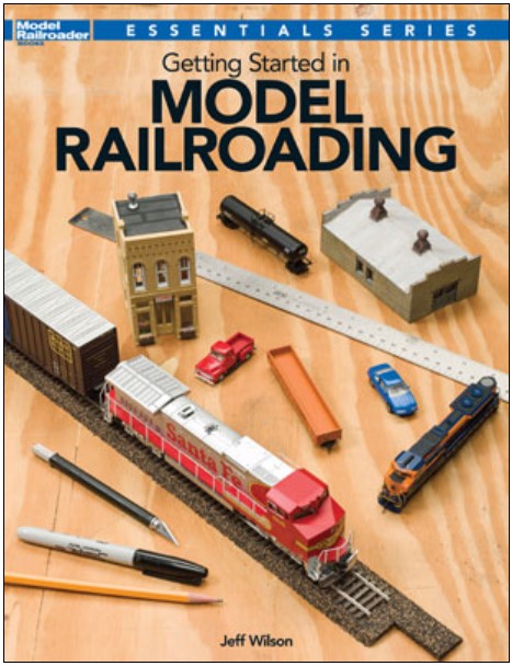 Book cover of 'Getting Started in Model Railroading' with model trains and tracks on a wooden surface.